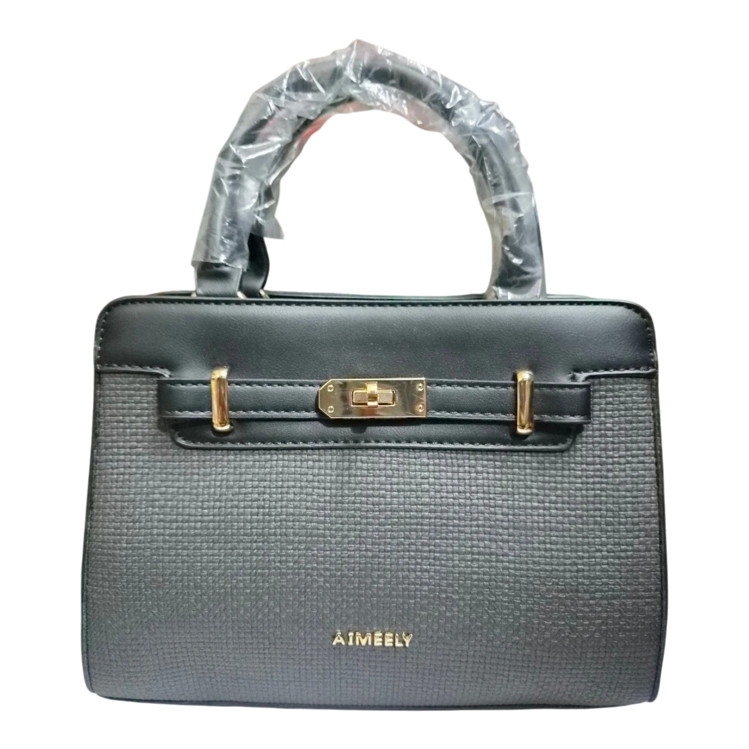 Sheonn AIMEELY structured handbag in black and charcoal grey with gold turn-lock hardware and top handle.