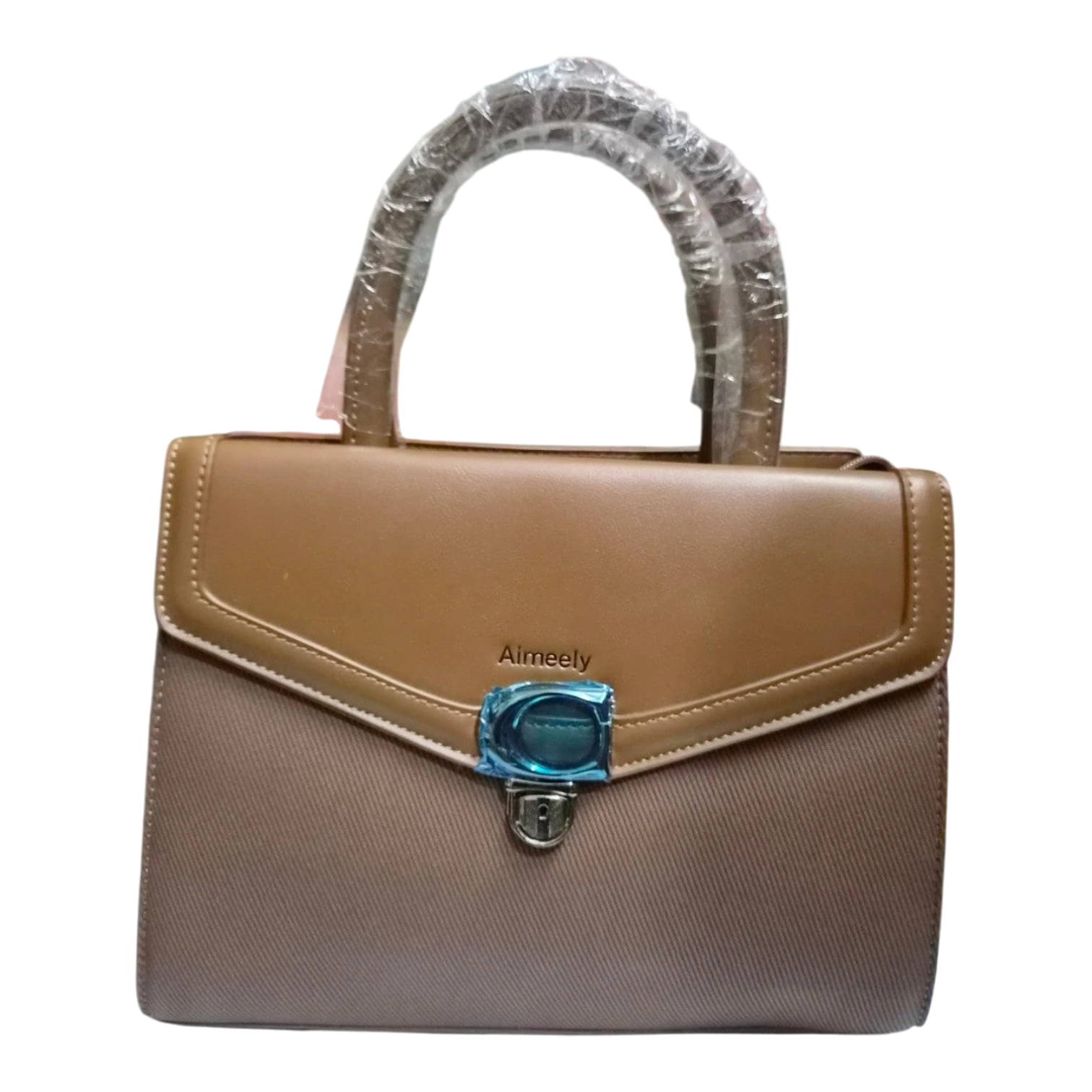 Sheonn Aimeely two-tone structured handbag in tan and taupe with a top handle and secure metal clasp closure.