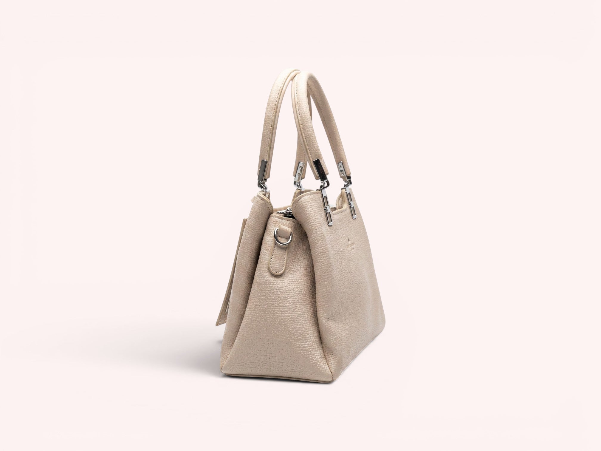 Sheonn beige textured faux leather structured top handle handbag with silver-tone hardware on a white background.