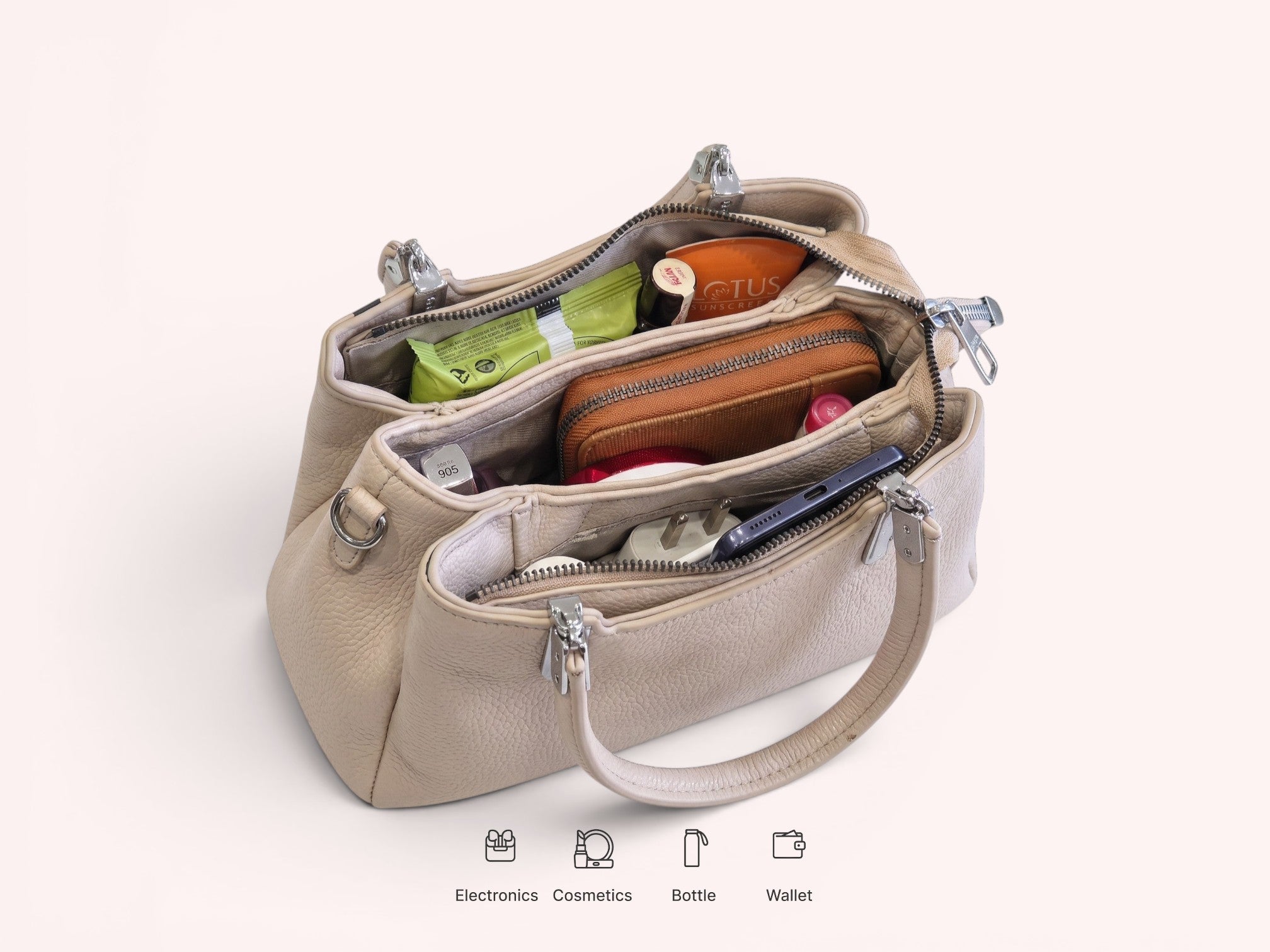Sheonn beige faux leather structured handbag with multiple interior compartments filled with daily essentials.