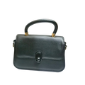 Sheonn black textured faux leather structured top handle handbag with gold hardware and a minimalist central clasp.