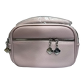 Sheonn blush pink pebble-textured faux leather crossbody bag with silver clover zipper pulls.