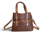 Sheonn brown faux leather tote handbag with pebbled texture, silver hardware, and dual carry handles.