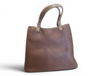 Sheonn brown faux leather tote handbag with a pebbled texture, sturdy handles, and a structured everyday design.