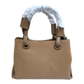Sheonn emelle tan synthetic leather structured top handle handbag with gold-toned branding and protective handle wrap.