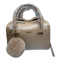 Sheonn IMEERY taupe structured handbag with a bow detail, gold hardware, and a matching faux-fur pom-pom charm.