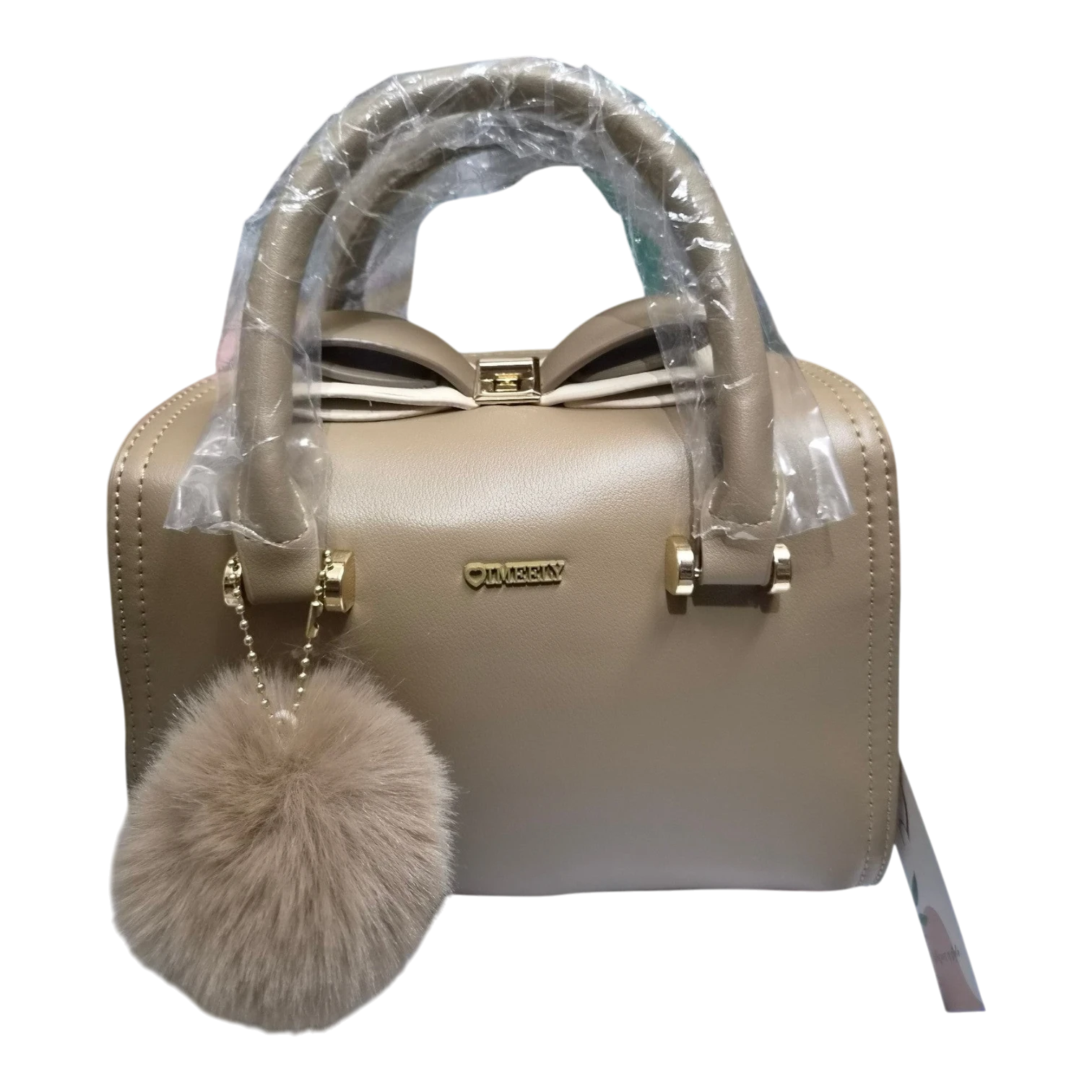 Sheonn IMEERY taupe structured handbag with a bow detail, gold hardware, and a matching faux-fur pom-pom charm.