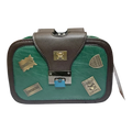 Sheonn structured faux leather crossbody bag in green and brown with whimsical metal teddy bear patches and clasp.