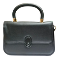 Sheonn black textured faux leather structured top handle handbag with gold-tone hardware and minimalist clasp.