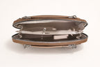 Sheonn tan structured handbag interior with silver zipper, central pocket, and organized compartments.