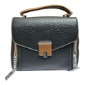 Sheonn black pebble-textured faux leather satchel with tan handle, central clasp, and side chain zipper details.