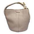 Sheonn beige pebble-grain synthetic leather bucket handbag with a patterned silk-style scarf wrapped on the handle.